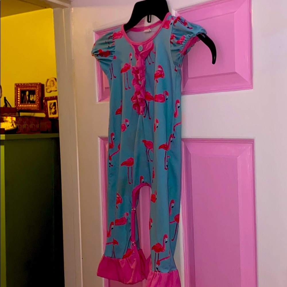A pink flamingo jumper
